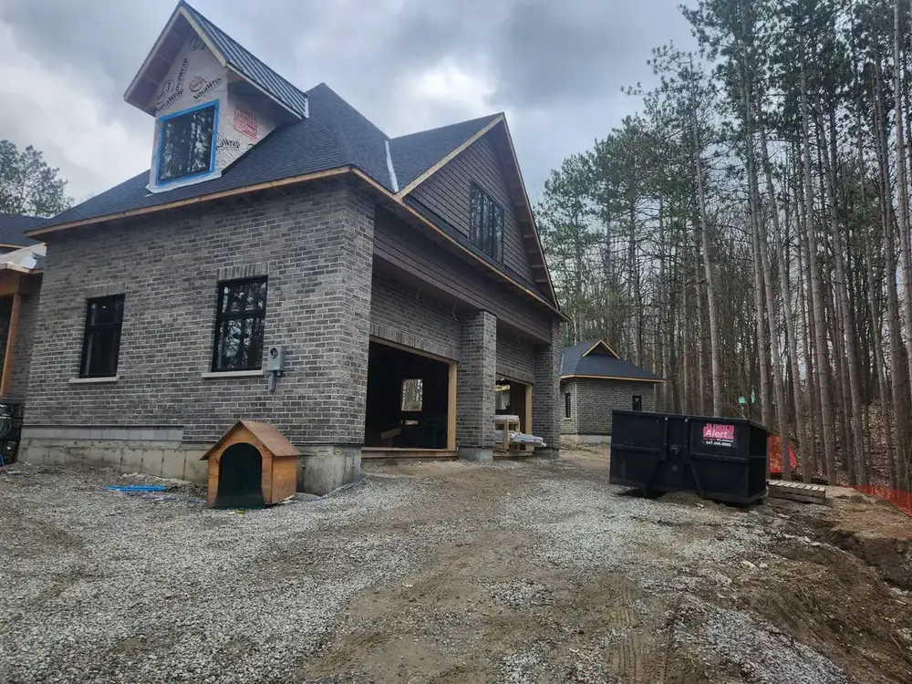Bin on site at a stone house under construction