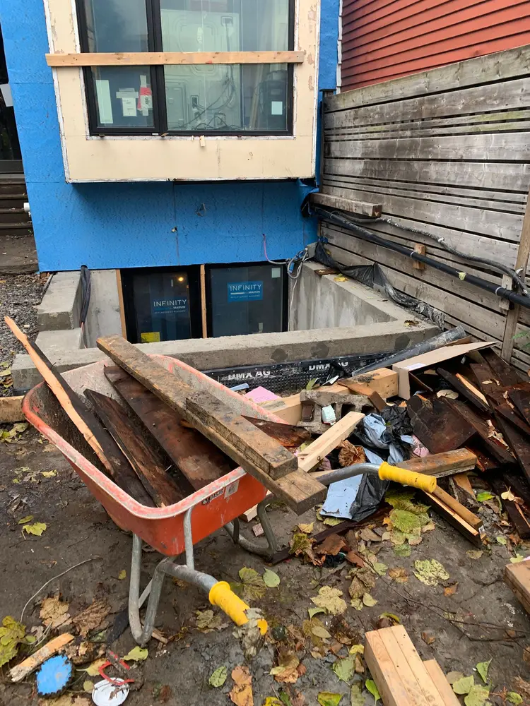 Before: Renovation debris cleared from a basement walkout
