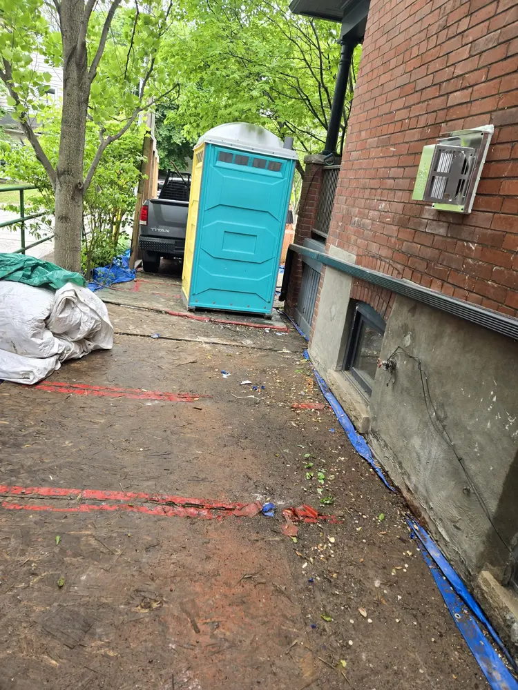 After: Pallets and site waste cleared from a side path